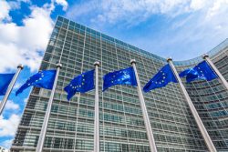 European flags in front of headquarters of European commission in Brussels in summer day